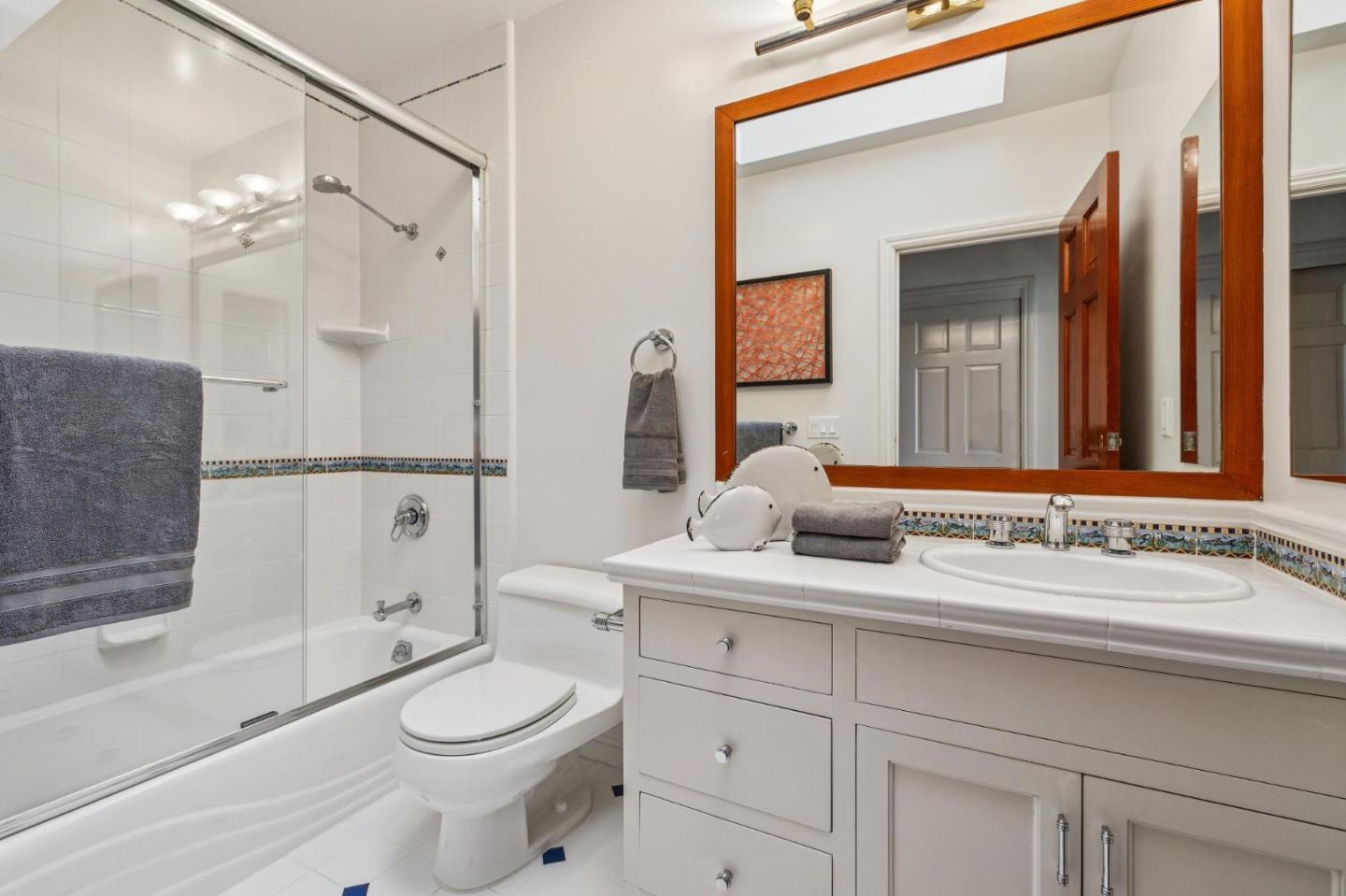 720 Endfield Way Hillsborough, CA 94010 - Photo 39 of 76 a bathroom with a sink a toilet and shower