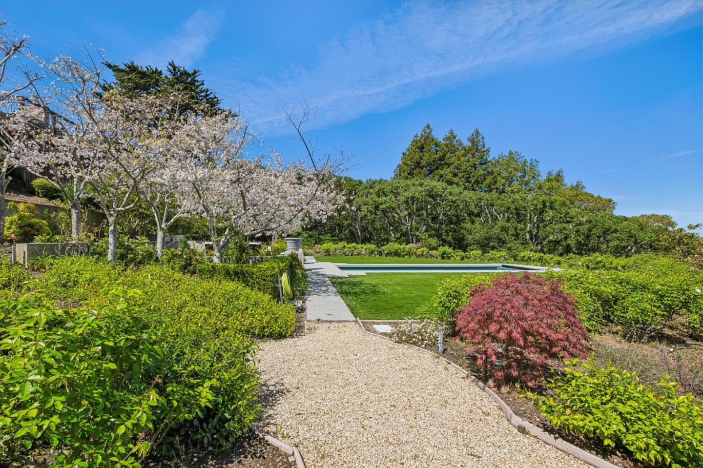 720 Endfield Way Hillsborough, CA 94010 - Photo 68 of 76 a view of a garden with a building in the background