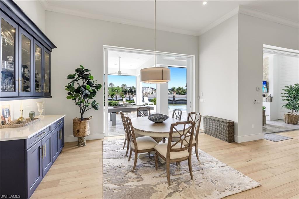 16415 Seneca Way Naples, FL 34110 - Photo 15 of 50 a dining room with furniture and window