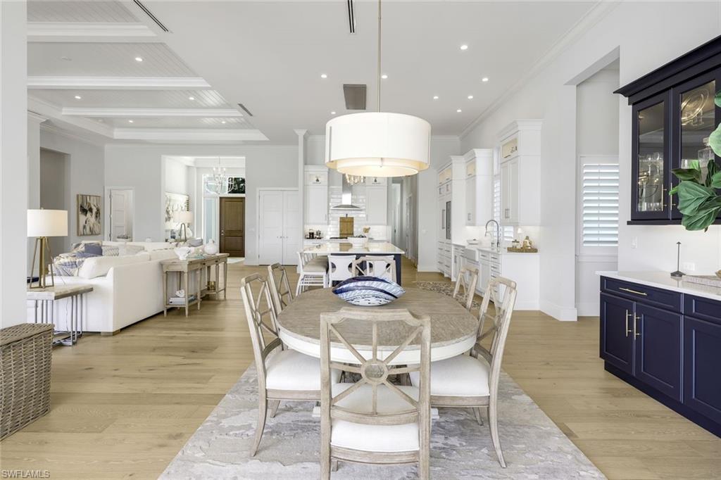 16415 Seneca Way Naples, FL 34110 - Photo 16 of 50 a view of a dining room with furniture