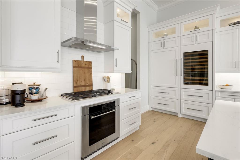 16415 Seneca Way Naples, FL 34110 - Photo 19 of 50 a kitchen with cabinets and appliances