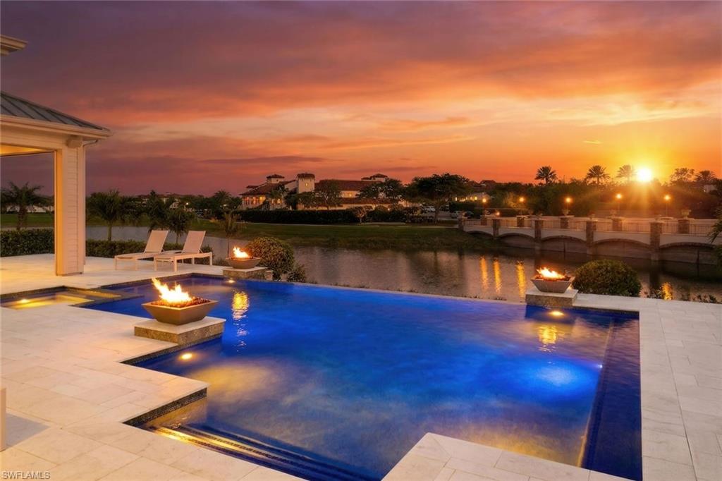 16415 Seneca Way Naples, FL 34110 - Photo 2 of 50 a view of a lake in a city