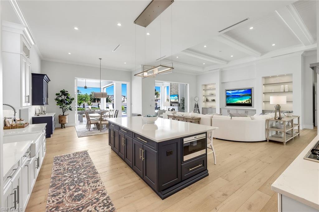 16415 Seneca Way Naples, FL 34110 - Photo 22 of 50 a kitchen with sink and view of living room