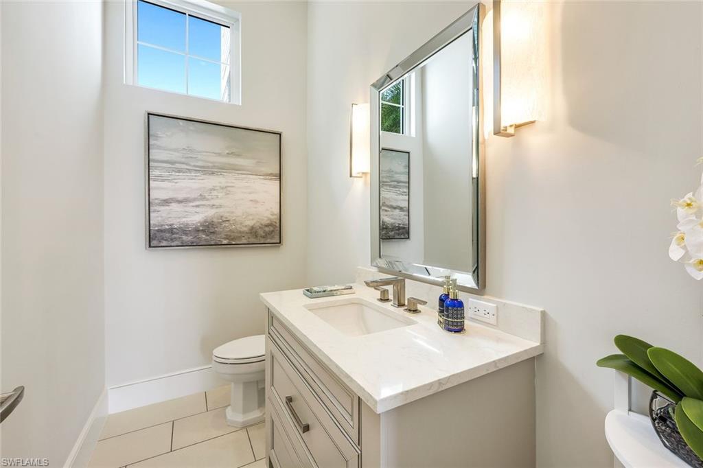 16415 Seneca Way Naples, FL 34110 - Photo 34 of 50 a bathroom with a sink and a toilet