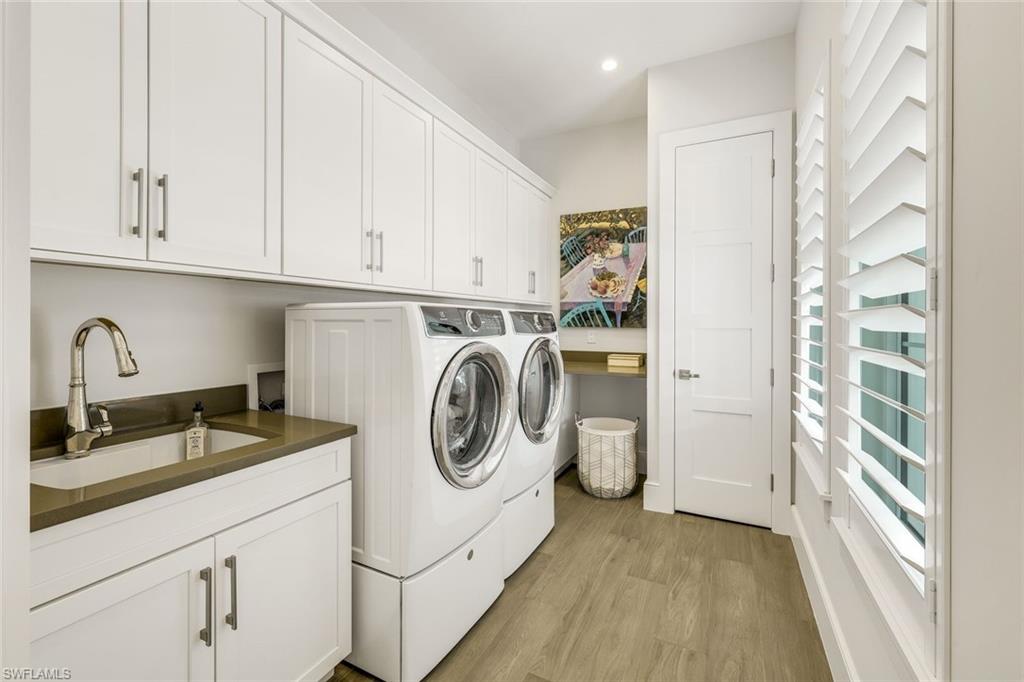 16415 Seneca Way Naples, FL 34110 - Photo 36 of 50 a utility room with sink dryer and washer