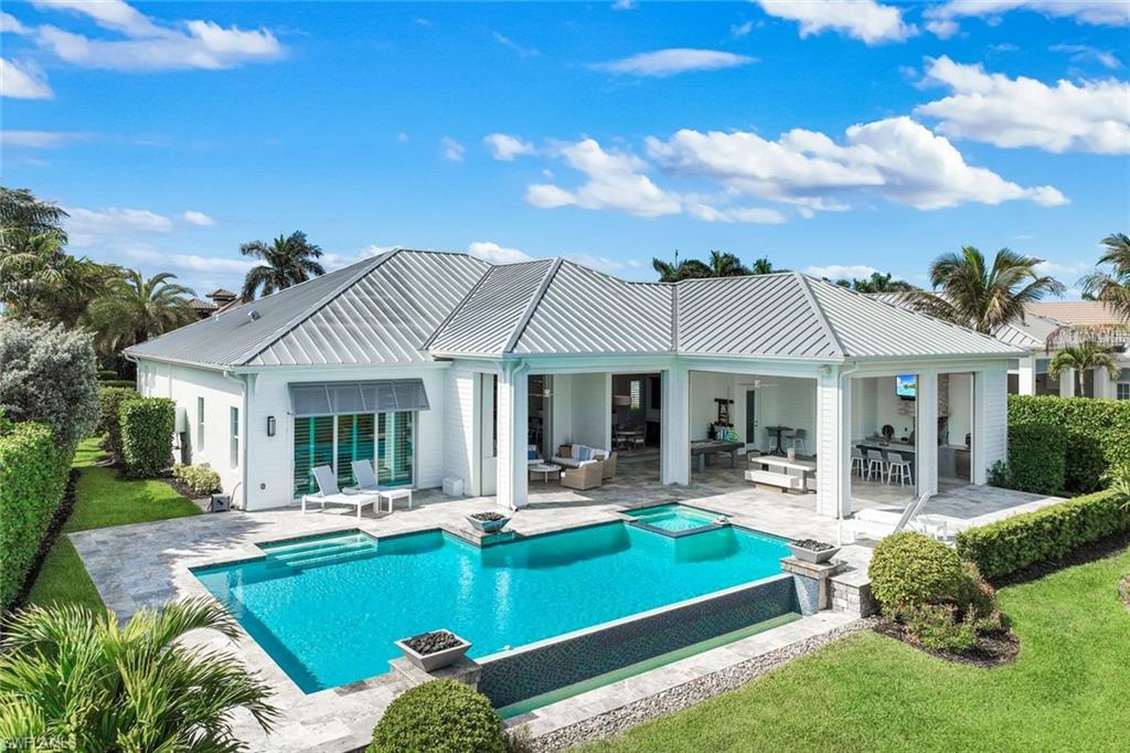 16415 Seneca Way Naples, FL 34110 - Photo 4 of 50 a front view of house and outdoor space
