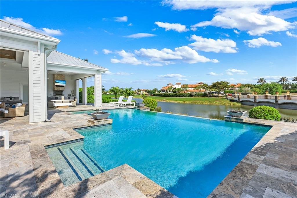 16415 Seneca Way Naples, FL 34110 - Photo 44 of 50 a view of a house with swimming pool and outdoor space