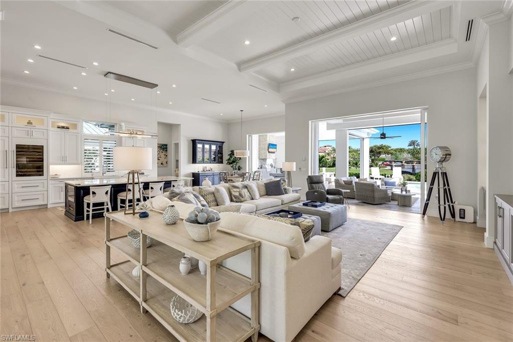 16415 Seneca Way Naples, FL 34110 - Photo 8 of 50 a living room with furniture and a wooden floor