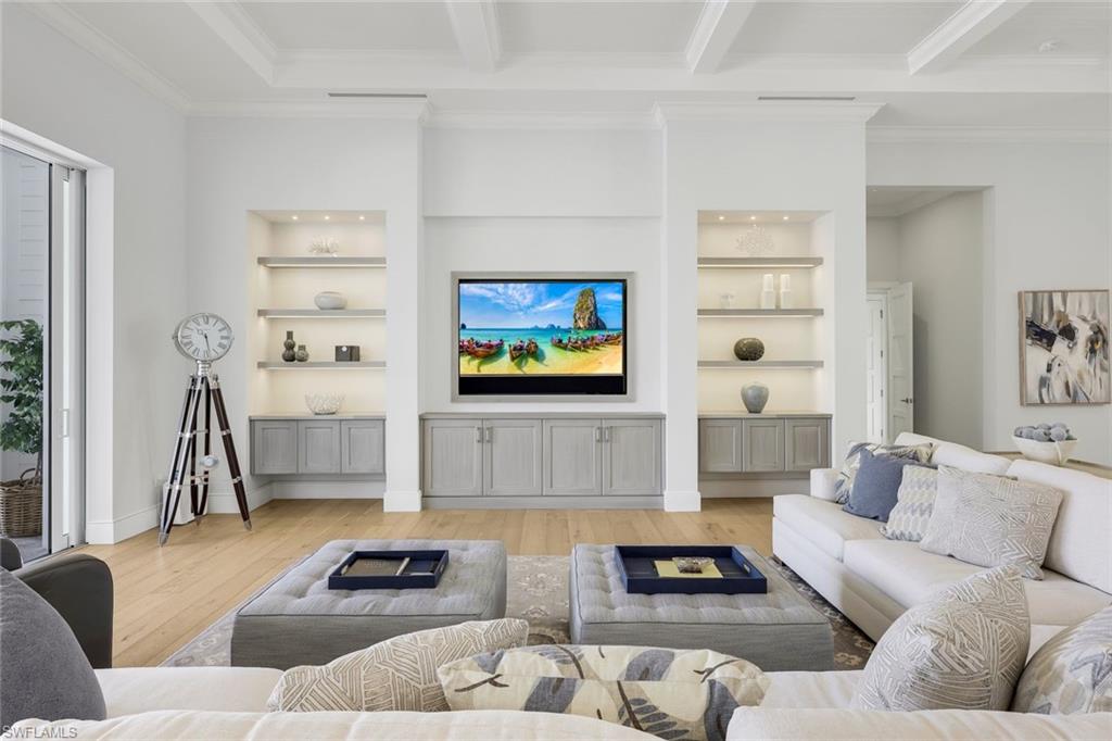16415 Seneca Way Naples, FL 34110 - Photo 9 of 50 a living room with furniture and a flat screen tv