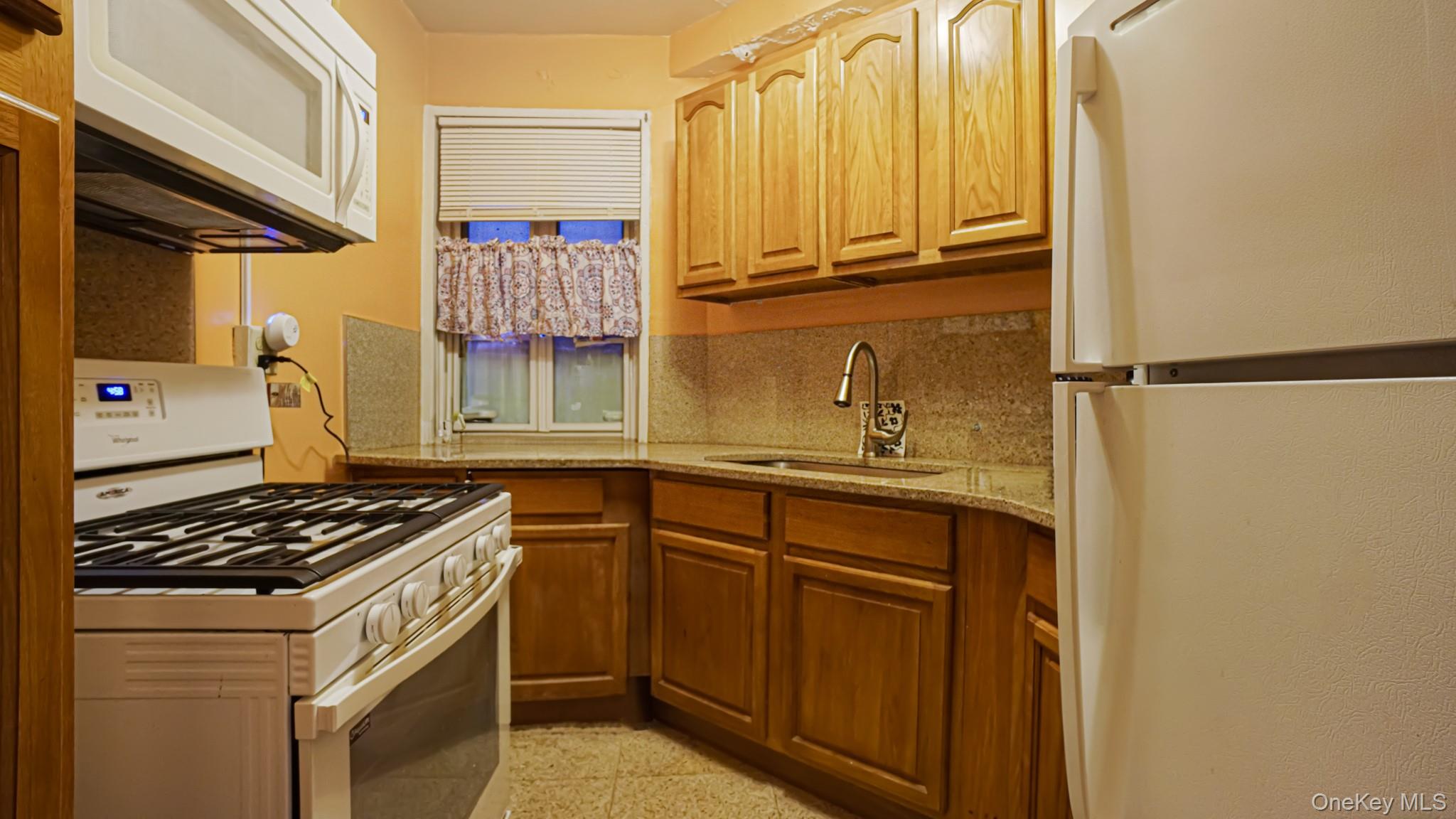 2075 St Raymond Avenue, Unit 5H Bronx, NY 10462 - Photo 8 of 8 a kitchen with stainless steel appliances a stove and a refrigerator