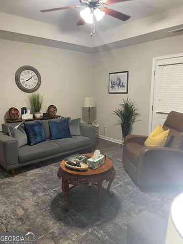 a living room with furniture and a table
