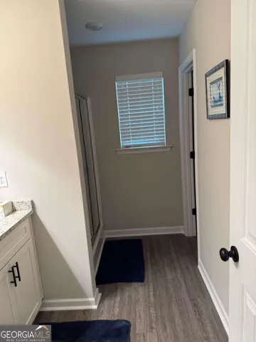 a view of front door with wooden floor