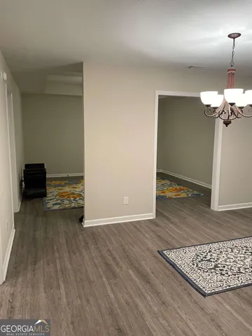 a view of a livingroom with wooden floor