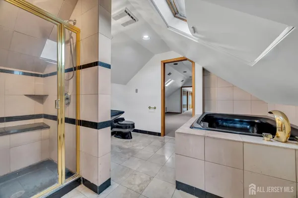 a kitchen with stainless steel appliances kitchen island granite countertop a refrigerator and a stove