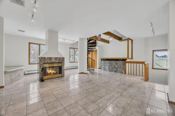 a view of kitchen with furniture and a fireplace
