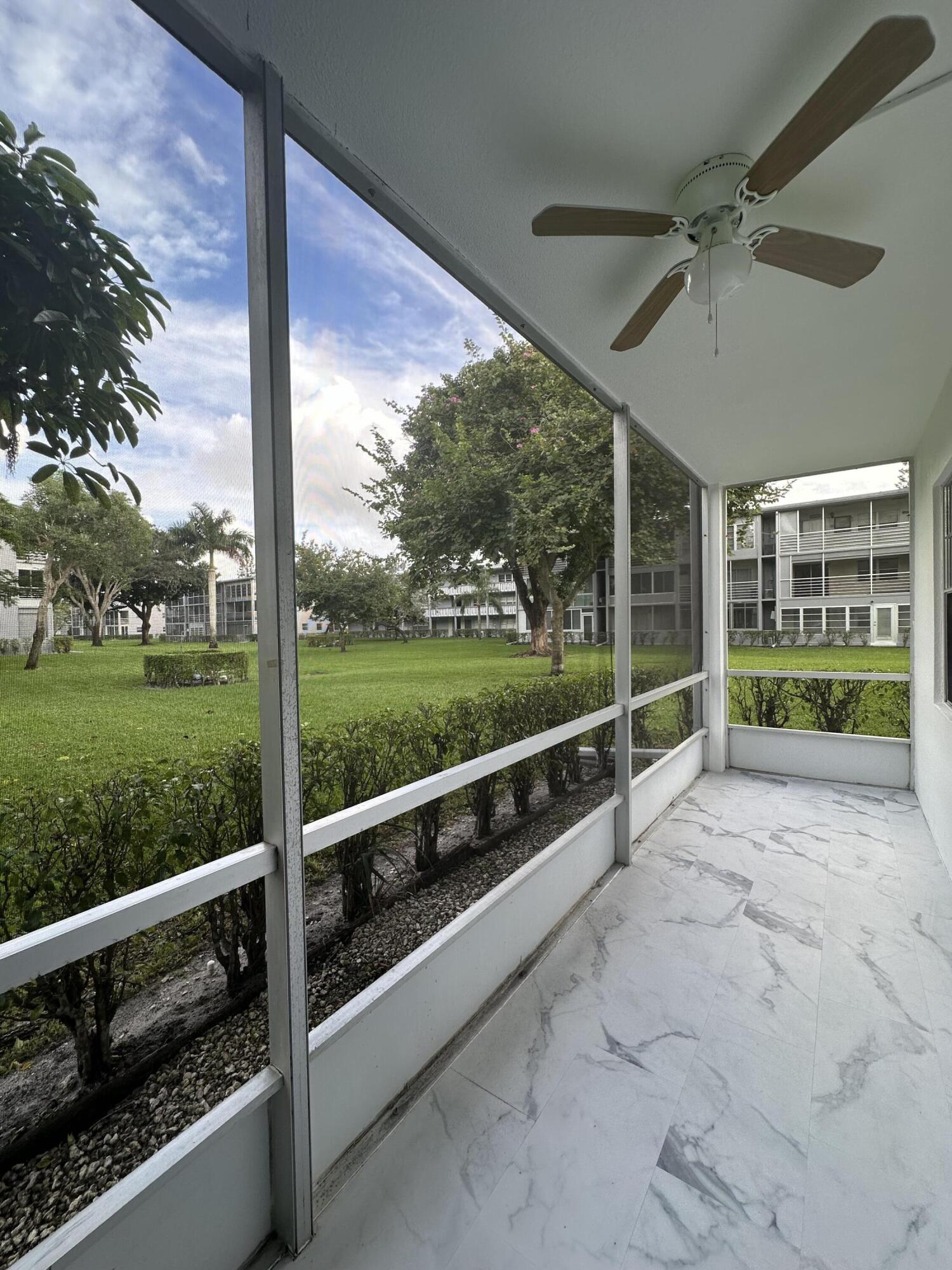 256 Suffolk F Boca Raton, FL 33434 - Photo 20 of 24 a view of balcony with mountain view and a garden