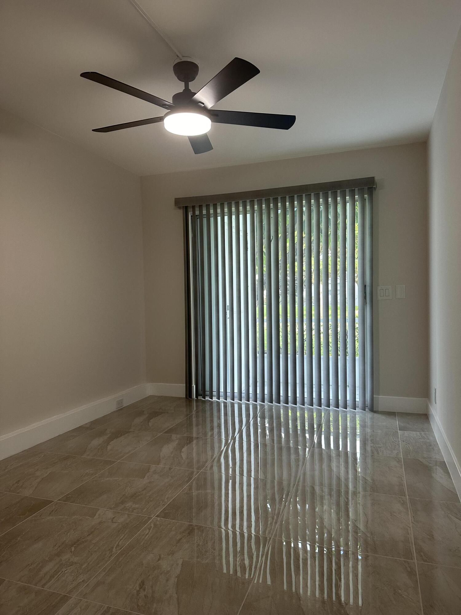 256 Suffolk F Boca Raton, FL 33434 - Photo 22 of 24 a view of an empty room with a window