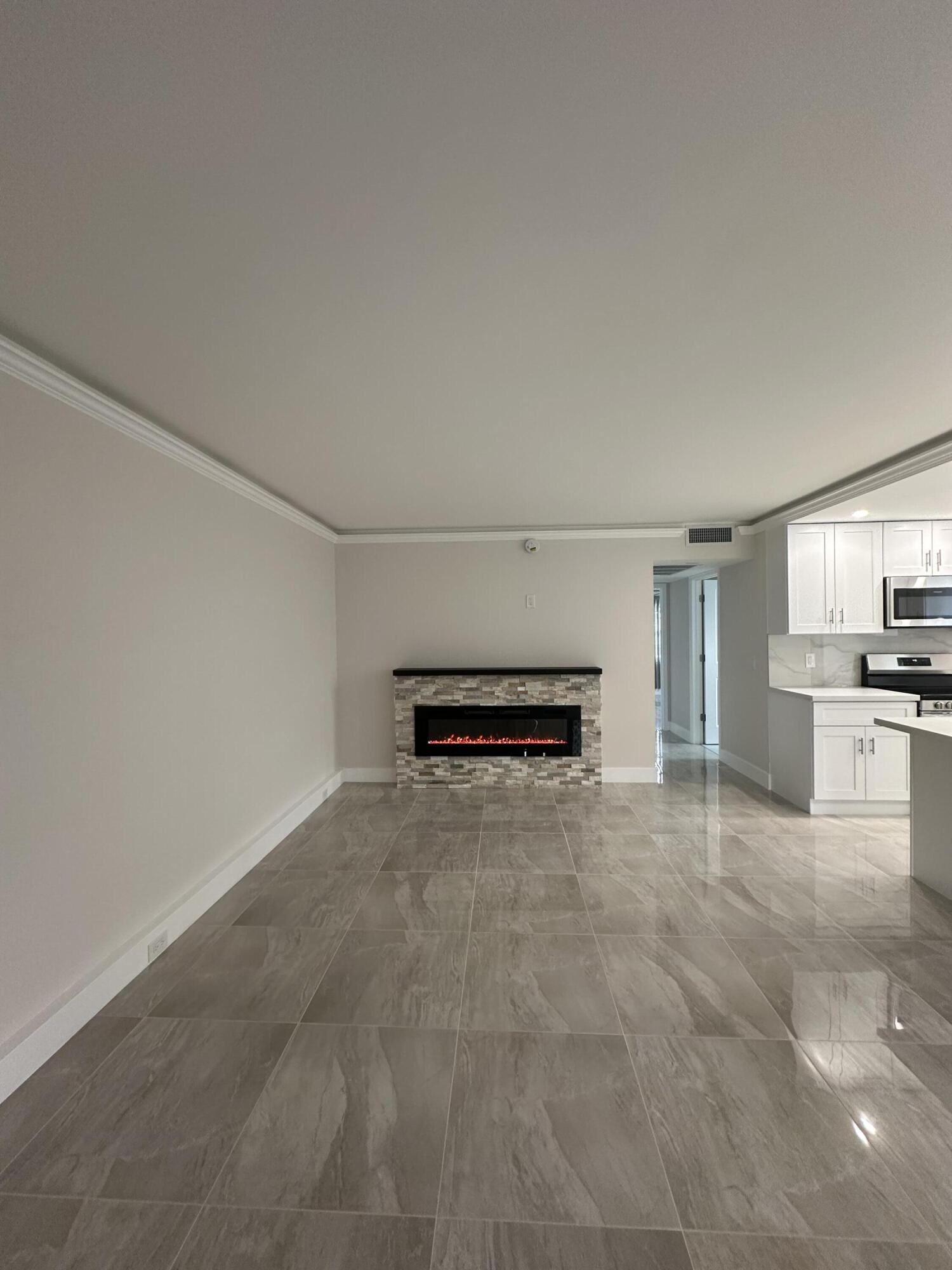 256 Suffolk F Boca Raton, FL 33434 - Photo 24 of 24 a view of kitchen with refrigerator and microwave