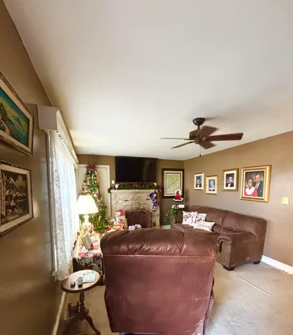 a kitchen with kitchen island a sink dishwasher stove and white cabinets with wooden floor
