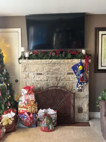 a view of a kitchen with fridge and wooden floor