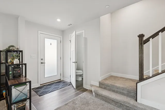 a view of a livingroom with furniture and empty room