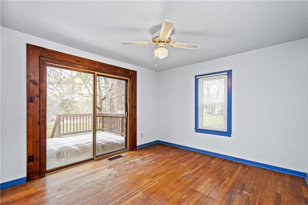 3910 Shepard Road Gibsonia, PA 15044 - Photo 13 of 25 a view of an empty room with wooden floor and a window