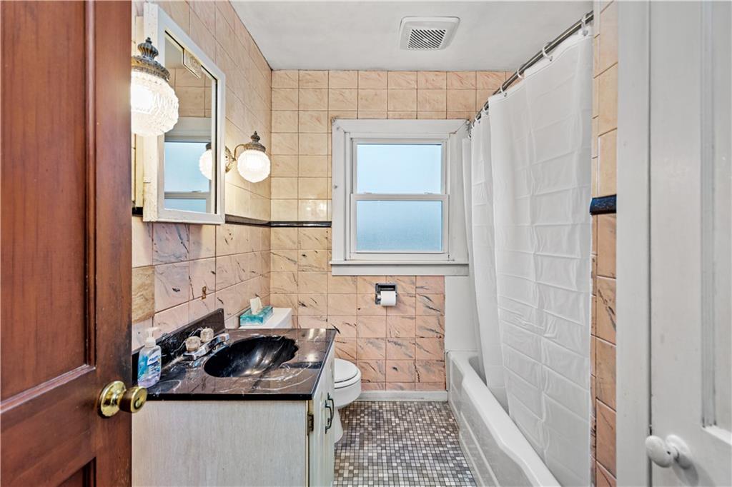 3910 Shepard Road Gibsonia, PA 15044 - Photo 14 of 25 a bathroom with a sink and a mirror