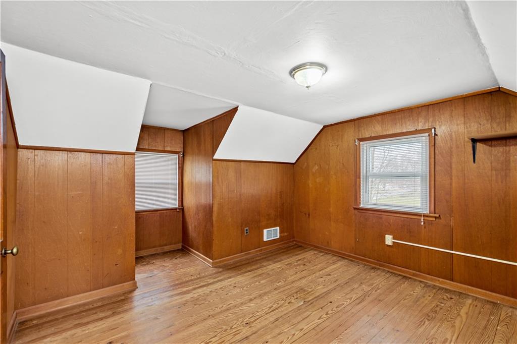 3910 Shepard Road Gibsonia, PA 15044 - Photo 17 of 25 a view of an empty room with wooden floor and a window