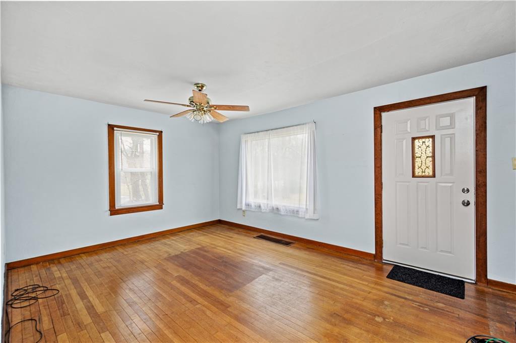 3910 Shepard Road Gibsonia, PA 15044 - Photo 7 of 25 a view of an empty room with window and wooden floor