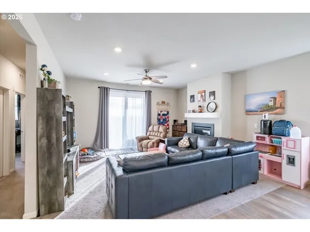 a living room with furniture window and wooden floor