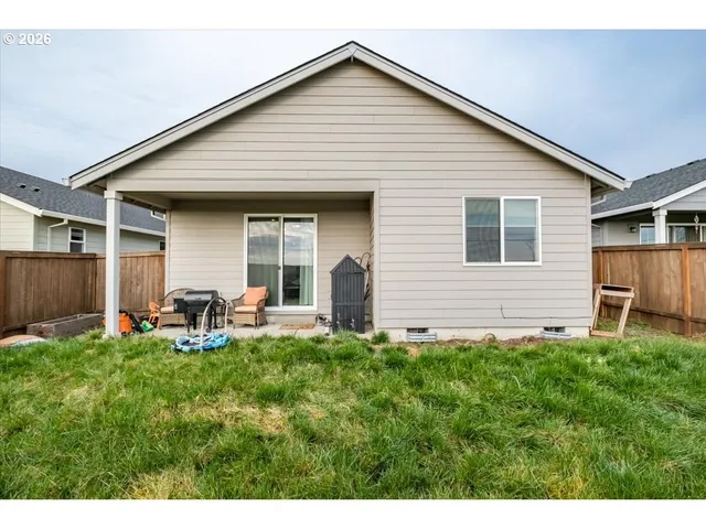 a view of a backyard of the house