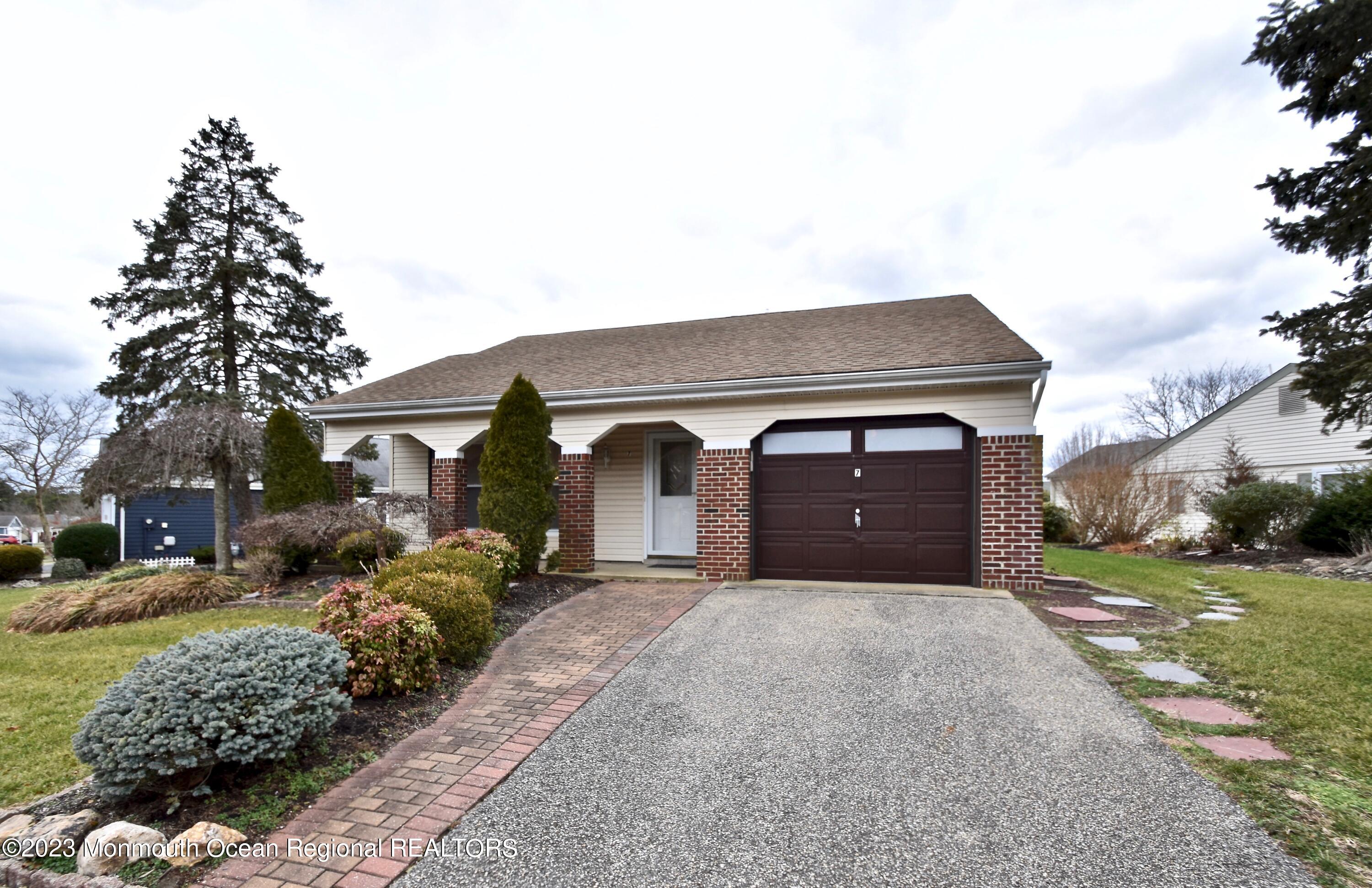 7 Flintshire Terrace Manchester Township, NJ 08759 - Photo 1 of 24 a front view of a house with a yard