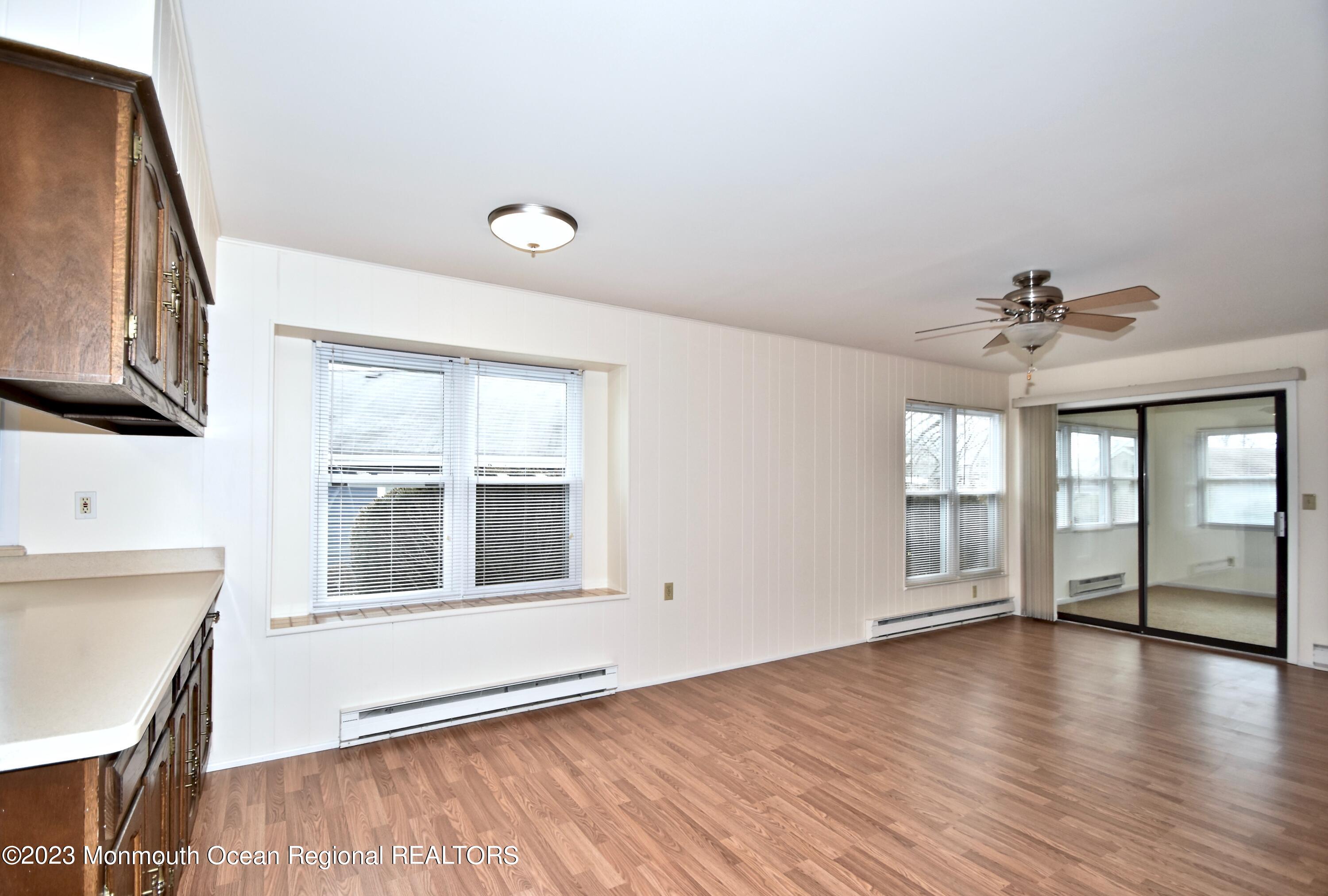 7 Flintshire Terrace Manchester Township, NJ 08759 - Photo 11 of 24 a view of an empty room with window and wooden floor
