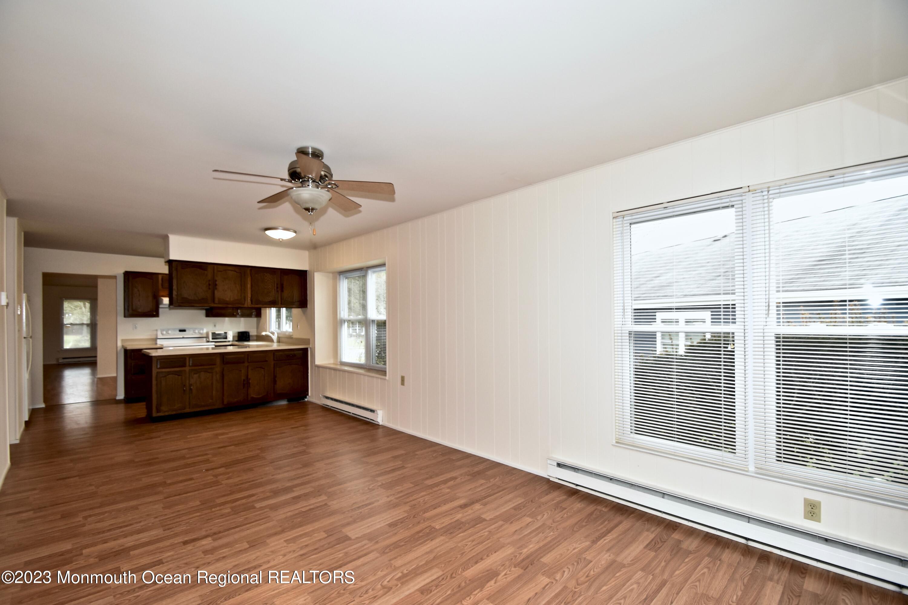 7 Flintshire Terrace Manchester Township, NJ 08759 - Photo 12 of 24 a large room with a window and wooden floor