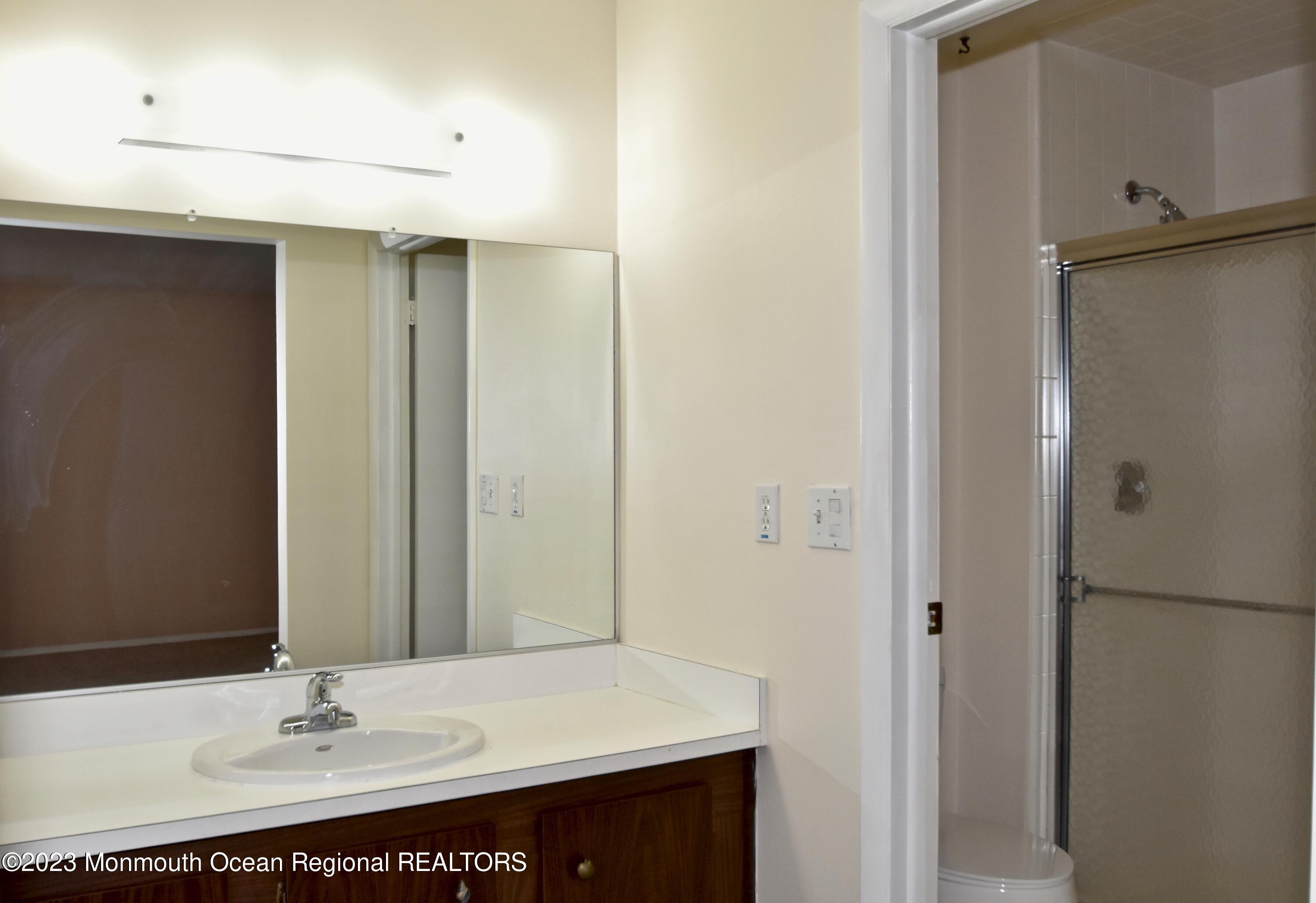 7 Flintshire Terrace Manchester Township, NJ 08759 - Photo 18 of 24 a bathroom with a sink and a mirror