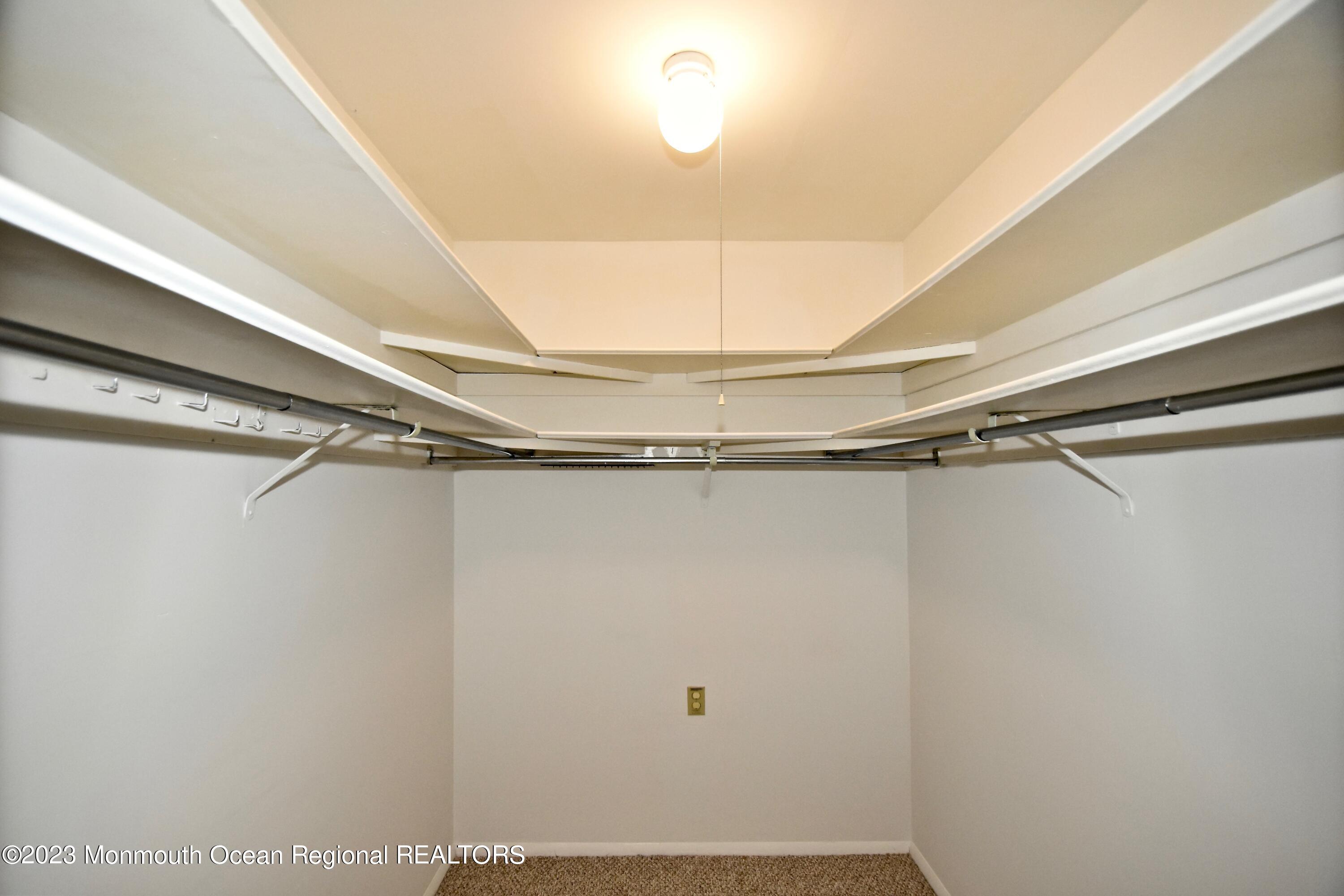 7 Flintshire Terrace Manchester Township, NJ 08759 - Photo 19 of 24 a view of a room with racks on the wall