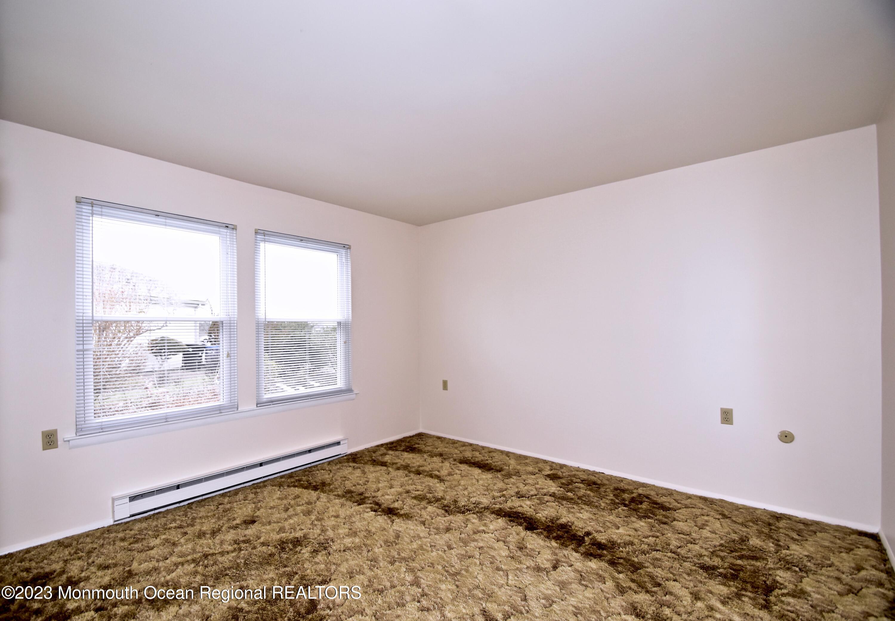 7 Flintshire Terrace Manchester Township, NJ 08759 - Photo 20 of 24 a view of a big room with wooden floor and a window