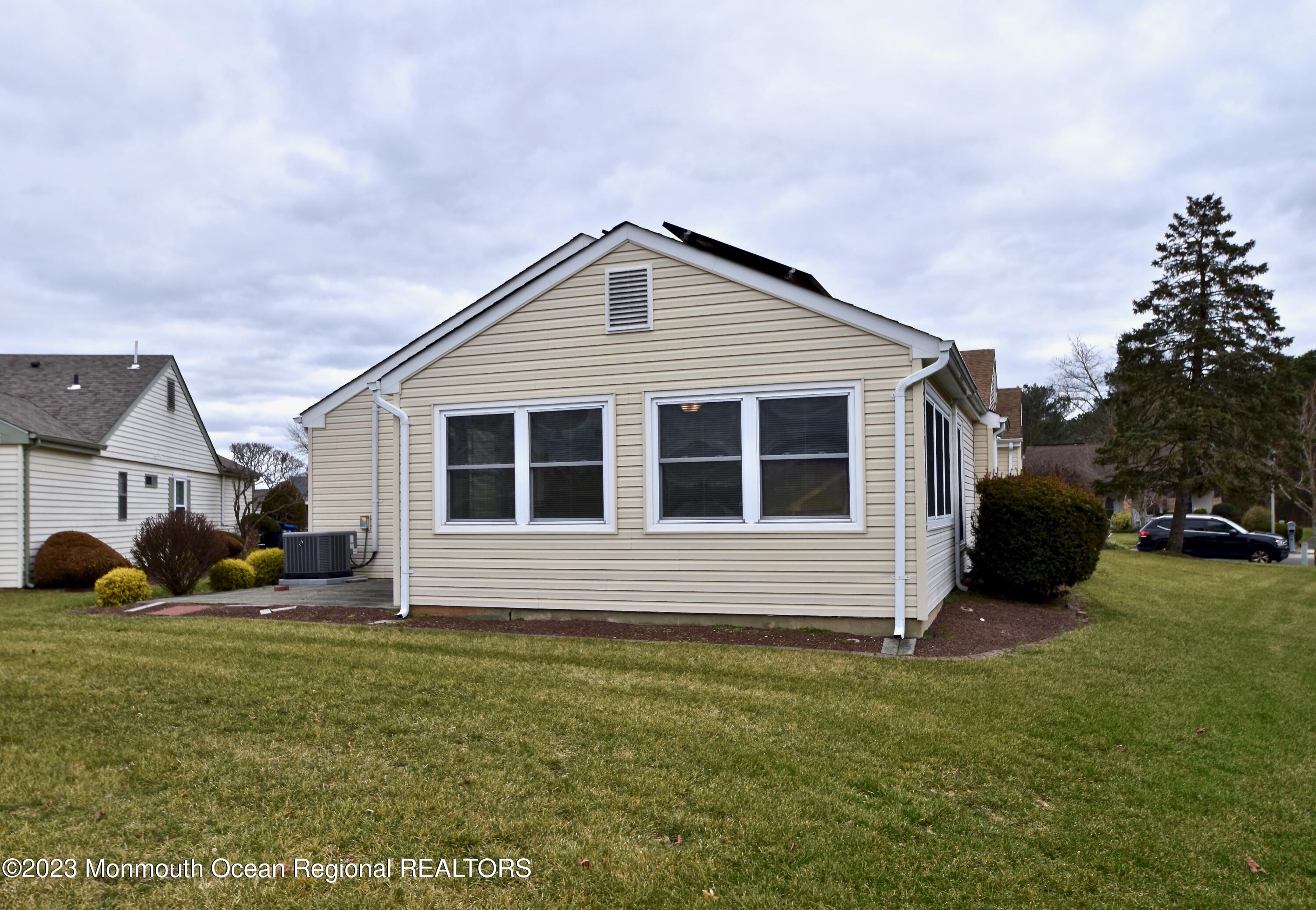 7 Flintshire Terrace Manchester Township, NJ 08759 - Photo 24 of 24 a front view of a house with a yard and garage