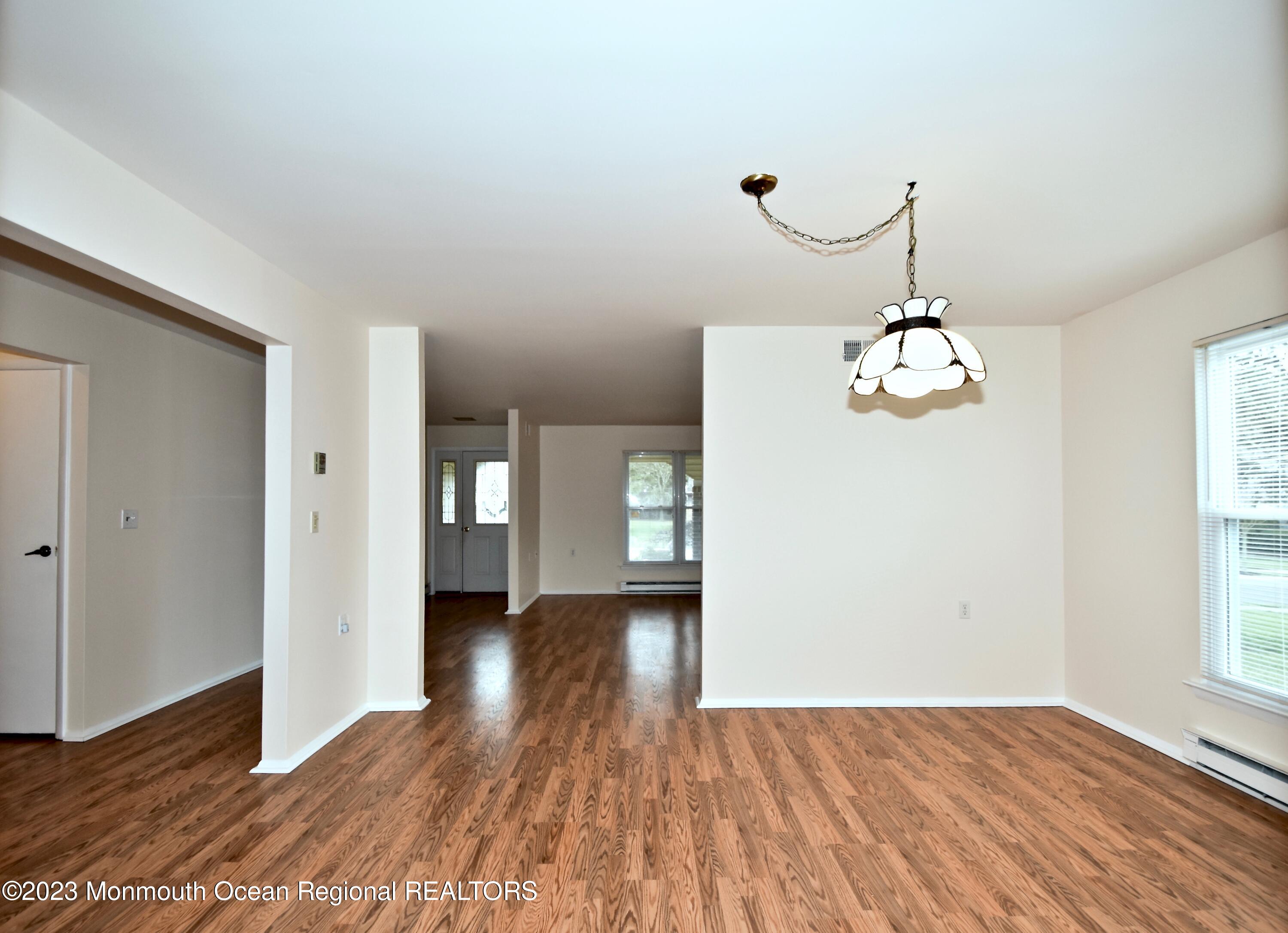 7 Flintshire Terrace Manchester Township, NJ 08759 - Photo 8 of 24 a view of livingroom with hardwood floor and kitchen view