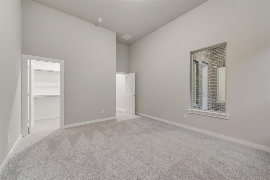 527 Embargo Drive Fate, TX 75189 - Photo 12 of 18 an empty room with windows and closet