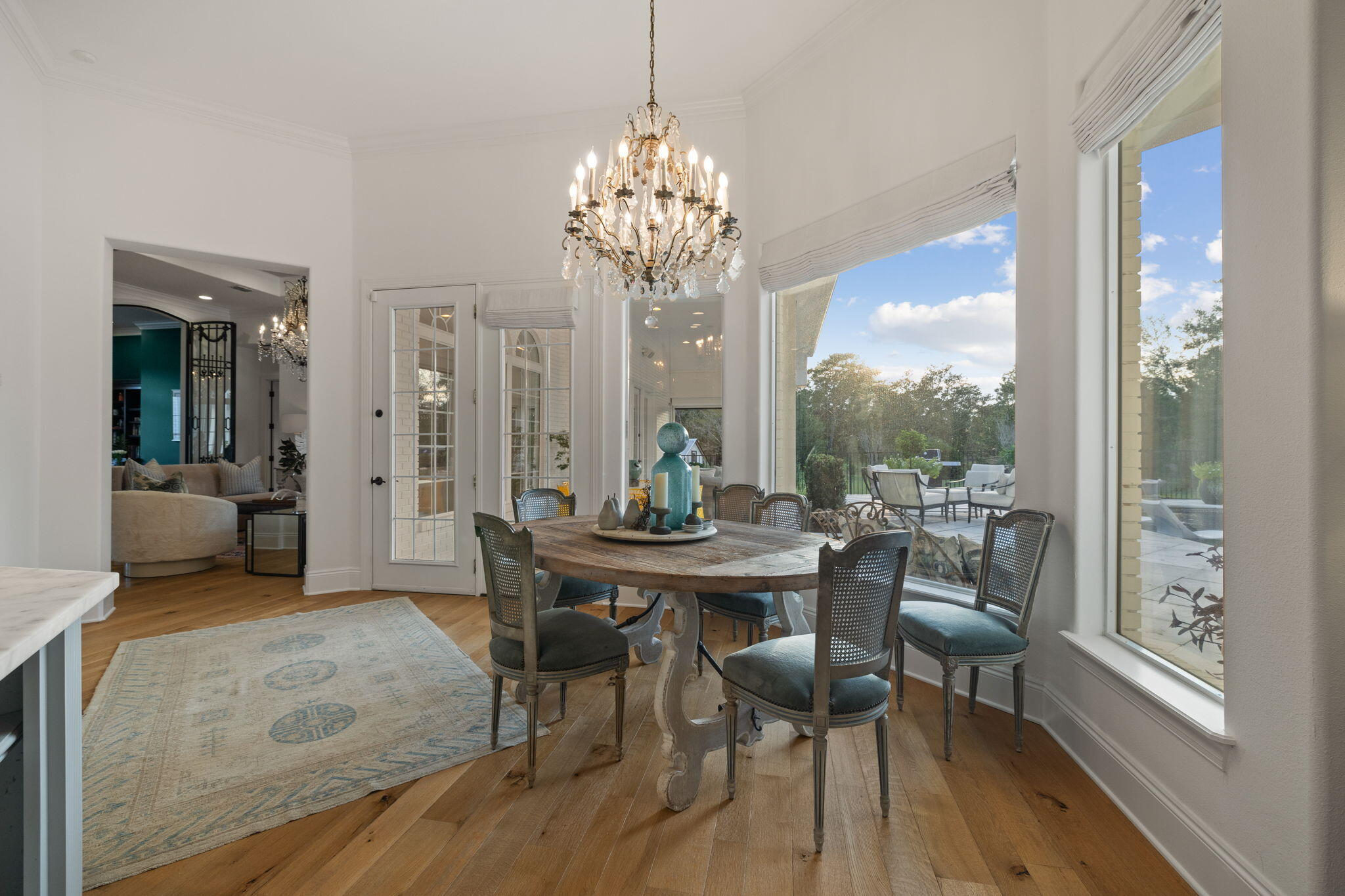 486 Coastal Breeze Drive Freeport, FL 32439 - Photo 15 of 70 a view of a dining room with furniture wooden floor and chandelier