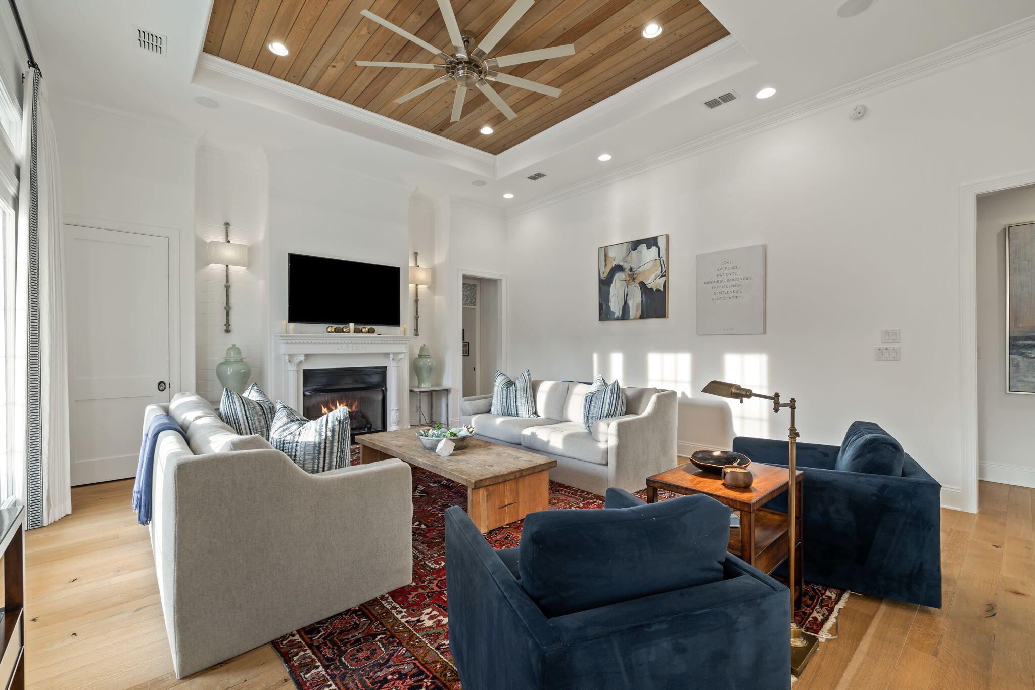 486 Coastal Breeze Drive Freeport, FL 32439 - Photo 16 of 70 a living room with furniture a fireplace and a flat screen tv