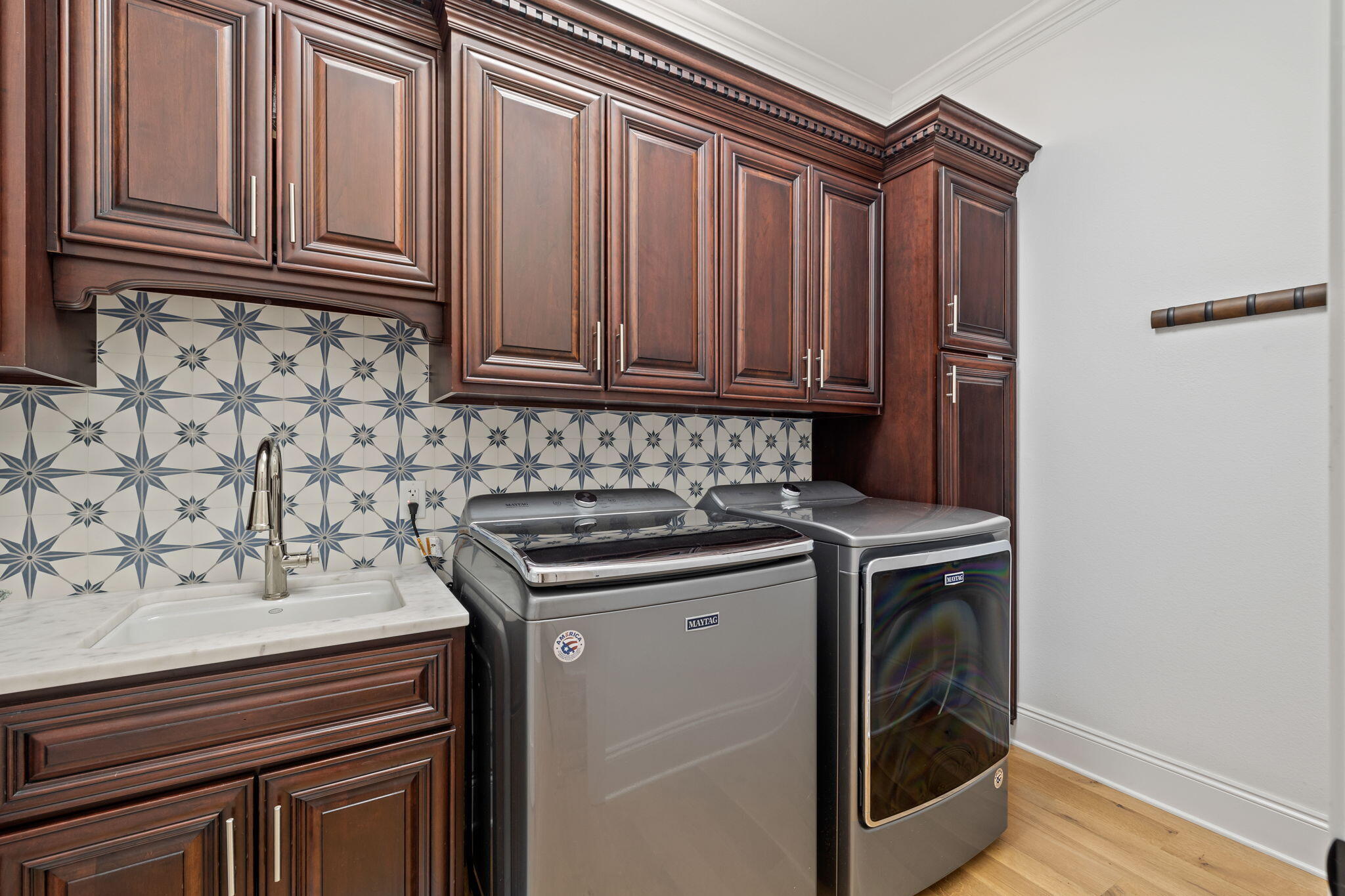 486 Coastal Breeze Drive Freeport, FL 32439 - Photo 20 of 70 a kitchen with granite countertop a sink stove and cabinets