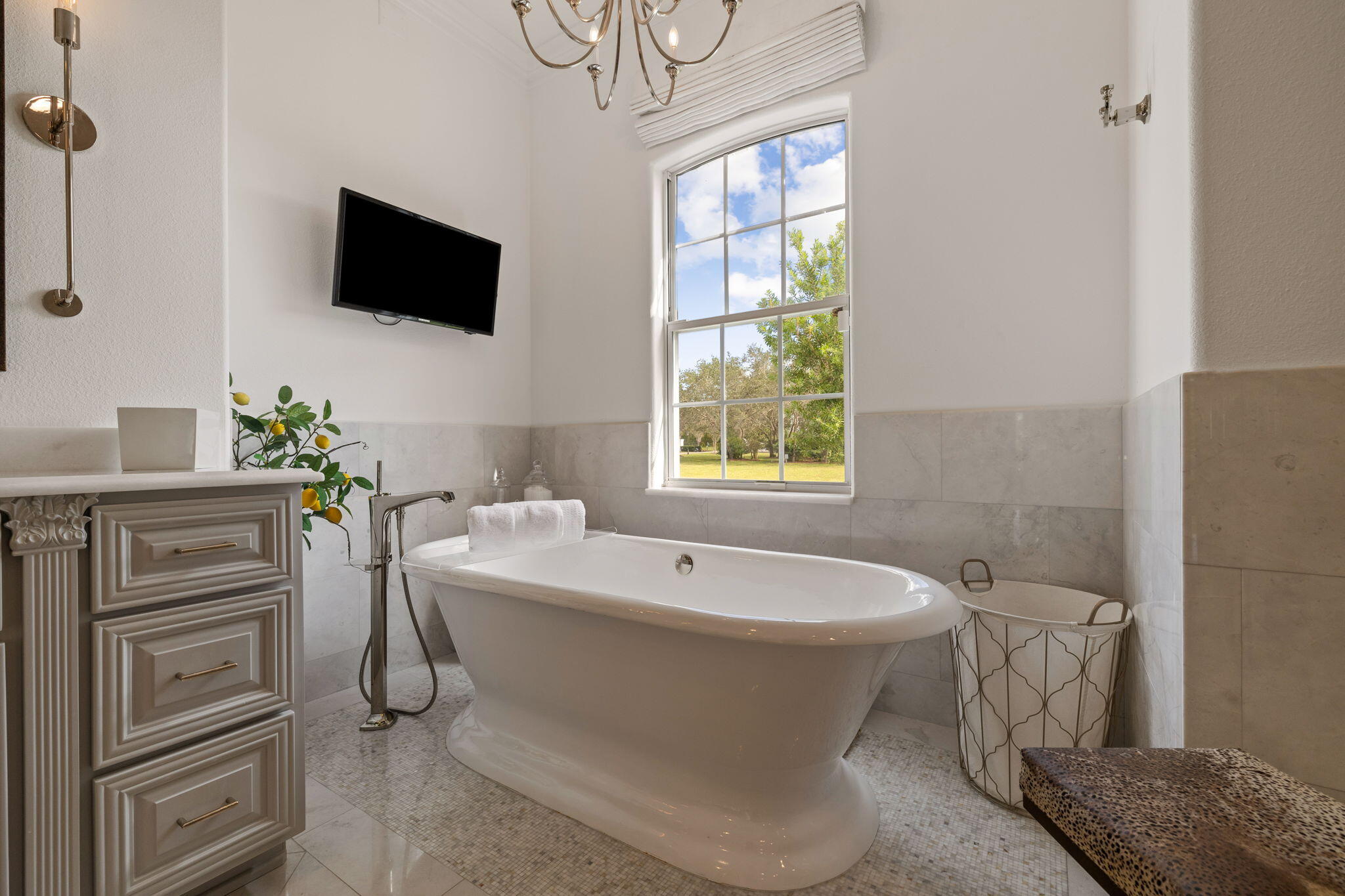 486 Coastal Breeze Drive Freeport, FL 32439 - Photo 24 of 70 a bathroom with a sink a toilet and a flat screen tv