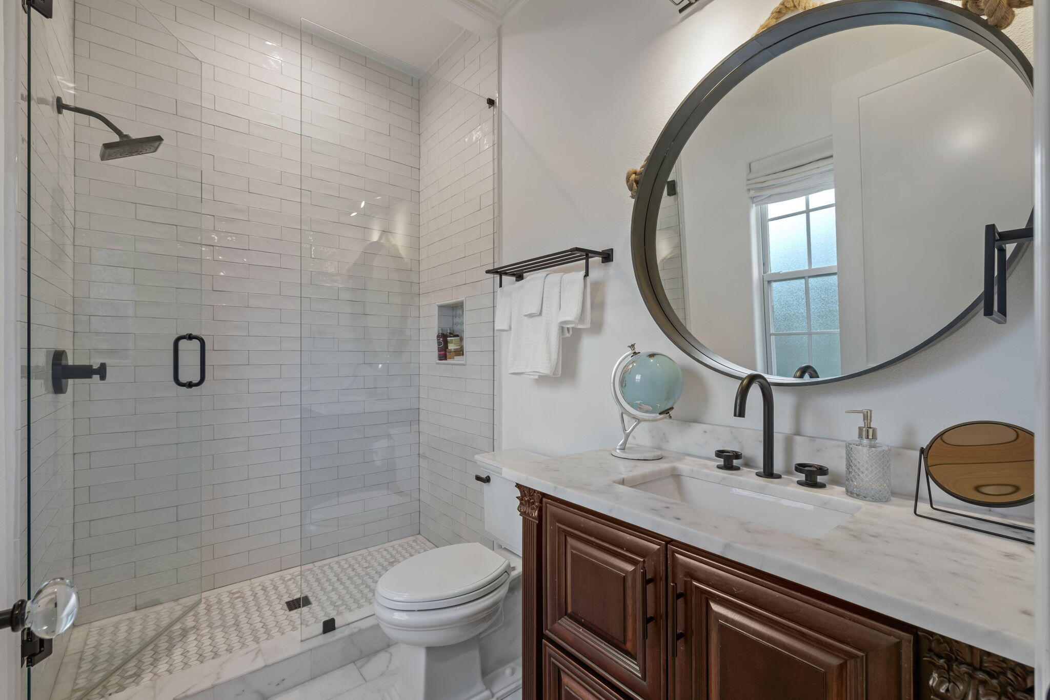 486 Coastal Breeze Drive Freeport, FL 32439 - Photo 29 of 70 a bathroom with a sink a toilet a mirror and shower