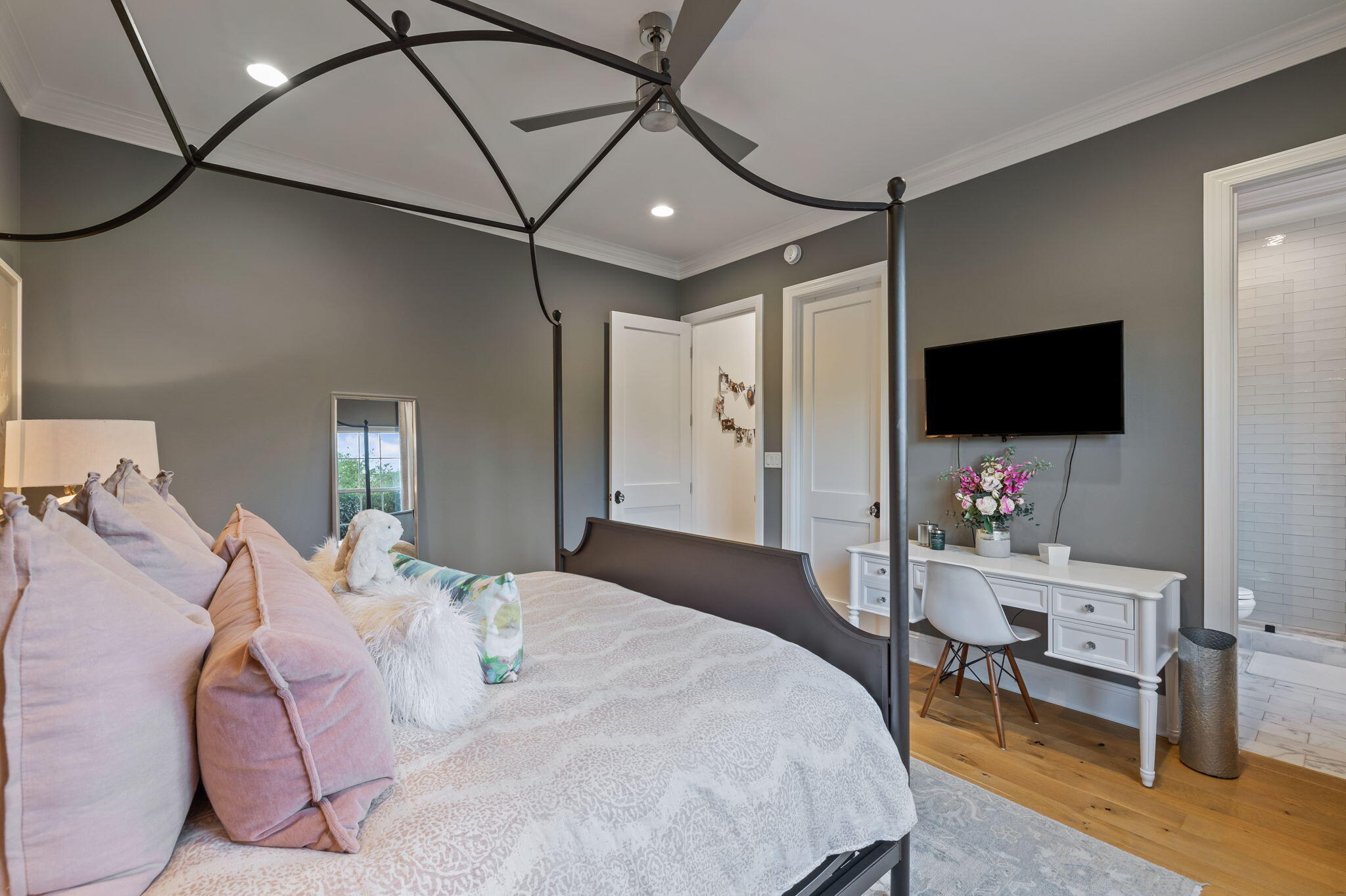 486 Coastal Breeze Drive Freeport, FL 32439 - Photo 31 of 70 a bedroom with a bed tv and wooden floor