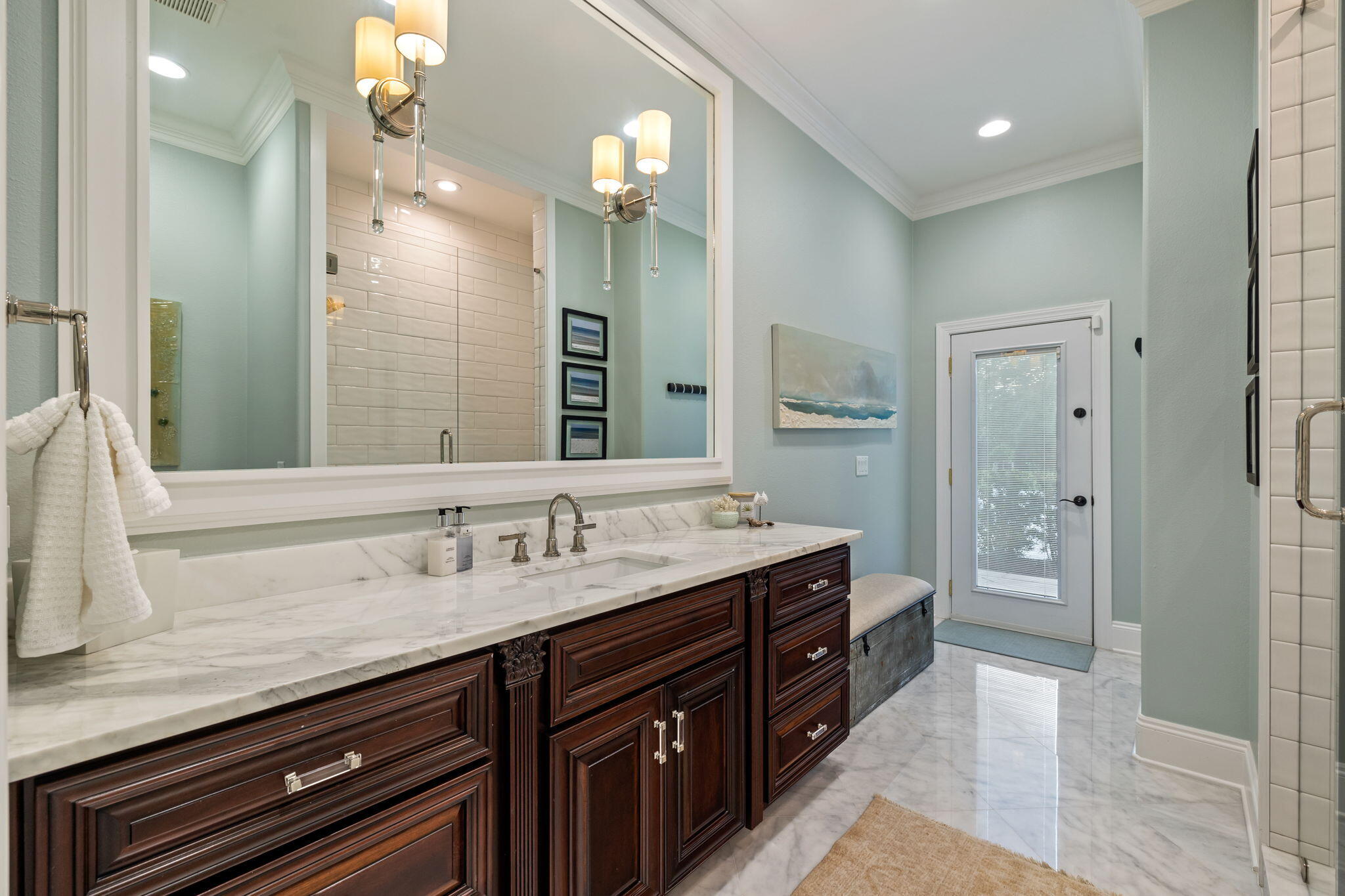 486 Coastal Breeze Drive Freeport, FL 32439 - Photo 36 of 70 a spacious bathroom with a granite countertop double vanity sink a mirror and a shower