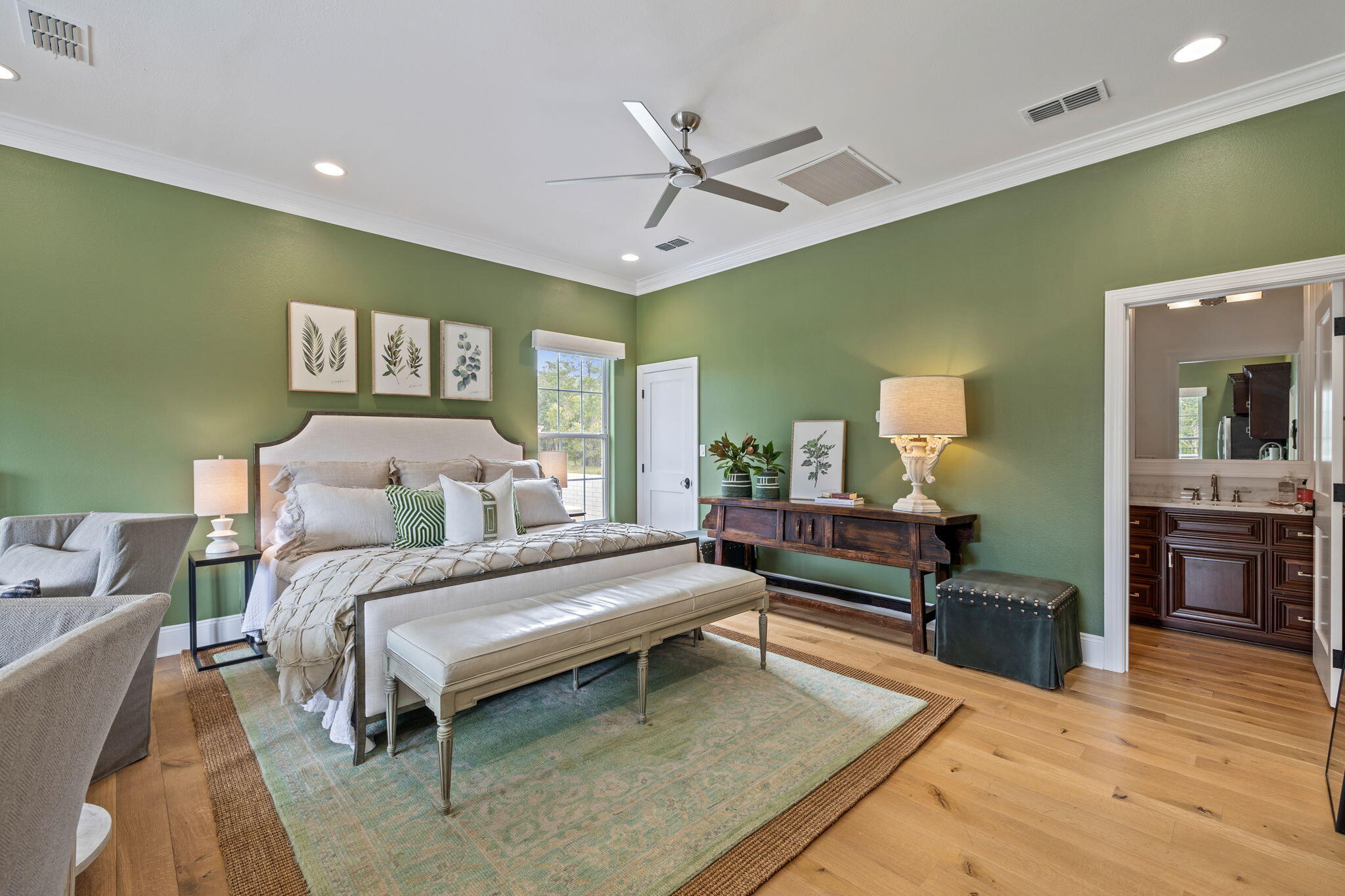 486 Coastal Breeze Drive Freeport, FL 32439 - Photo 39 of 70 a spacious bedroom with a bed and a chandelier