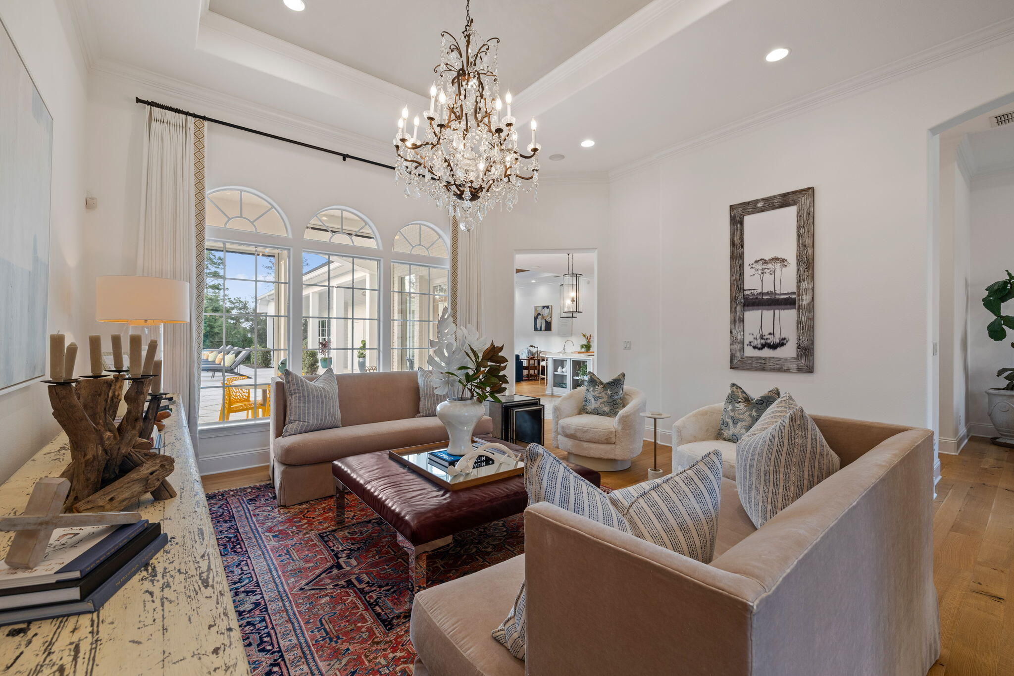 486 Coastal Breeze Drive Freeport, FL 32439 - Photo 5 of 70 a living room with furniture a chandelier and a dining table