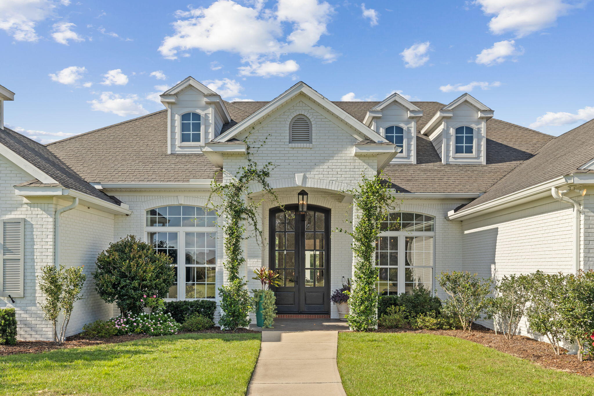 486 Coastal Breeze Drive Freeport, FL 32439 - Photo 51 of 70 a front view of a house with garden